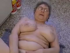 Fat woman with large bra buddies fucks her pussy with her sex toy 